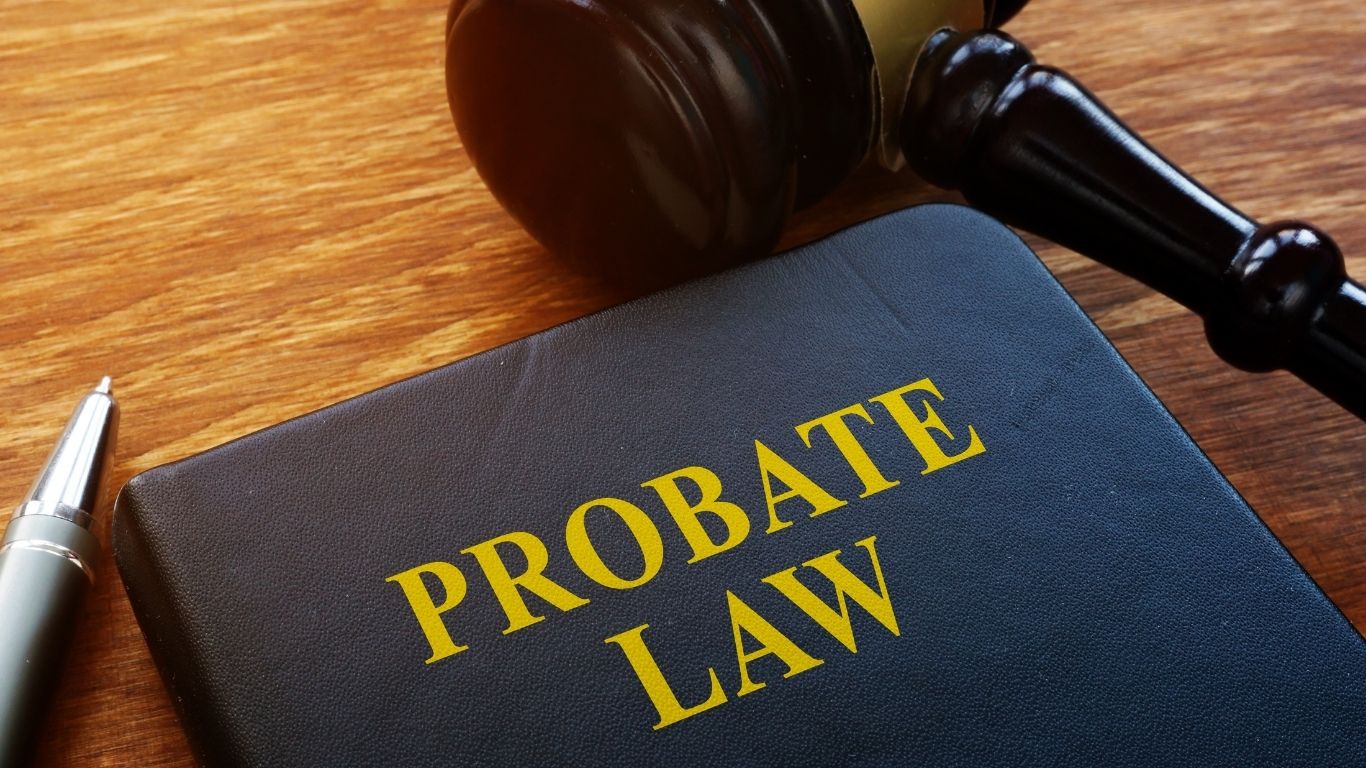 Estate planning lawyer NYC reviewing probate documents with a client in a Brooklyn law office