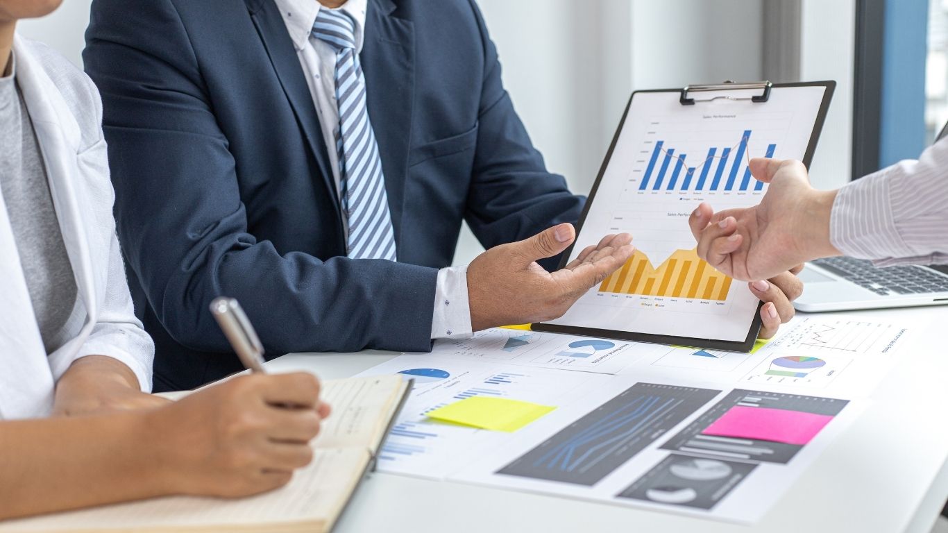 Business owner consulting with a New York attorney on legal strategy for business growth in a professional NYC law office.