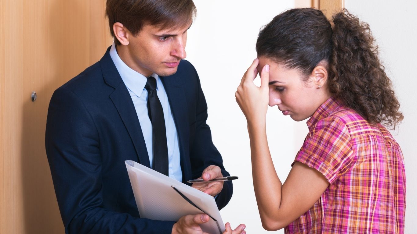 New York attorney advising a client on a tenant and landlord dispute during a professional consultation in a NYC law office.