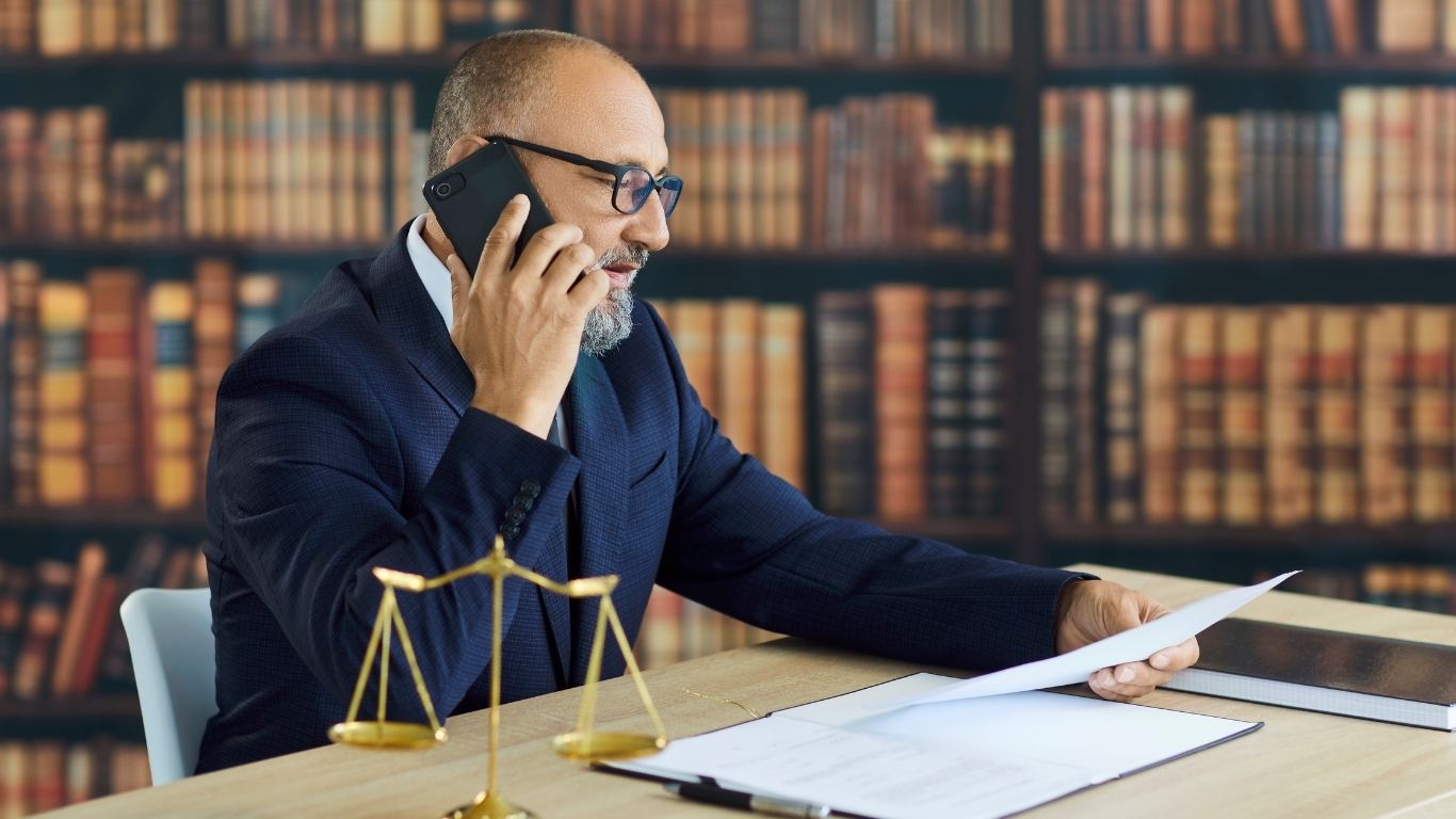 Litigation attorney in NYC reviewing documents for a complex business dispute
