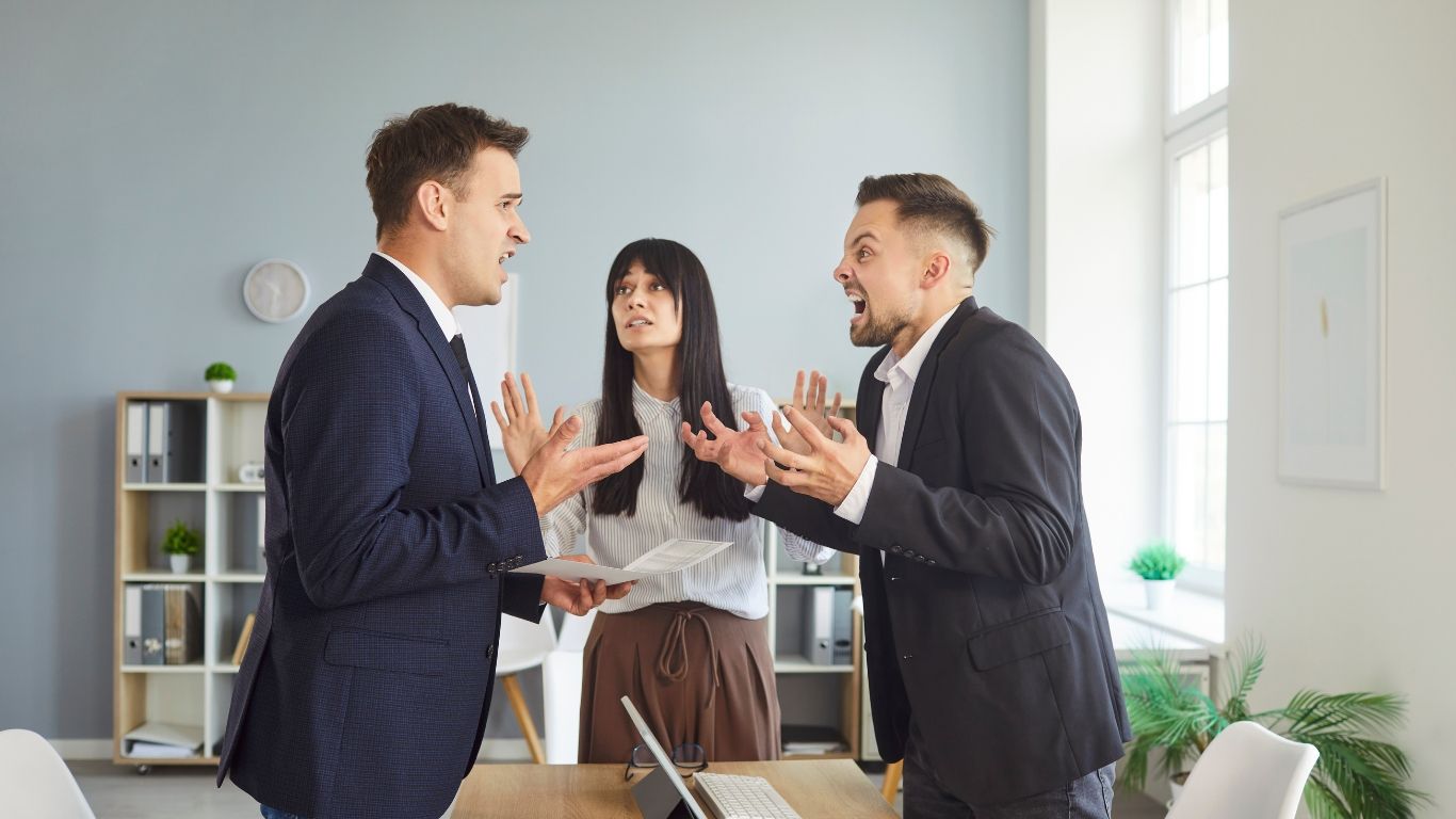 Business owners reviewing legal documents to resolve a business dispute in New York.